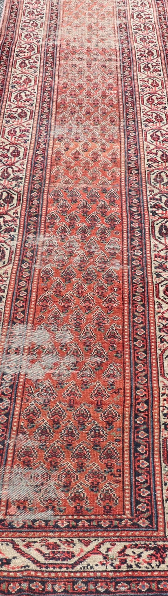 Distressed Antique Persian Malayer Runner with Field of Paisleys Design in Red Measures 3'2 x 15'2 This century old Persian Malayer defines the craftsmanship of this era. The multi - tier border features inner and outer guards decorat... - Keivan Woven ArtsBW - 1 - 20860Rug