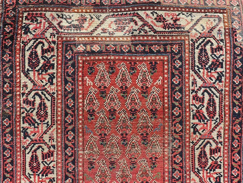 Distressed Antique Persian Malayer Runner with Field of Paisleys Design in Red Measures 3'2 x 15'2 This century old Persian Malayer defines the craftsmanship of this era. The multi - tier border features inner and outer guards decorat... - Keivan Woven ArtsBW - 1 - 20860Rug