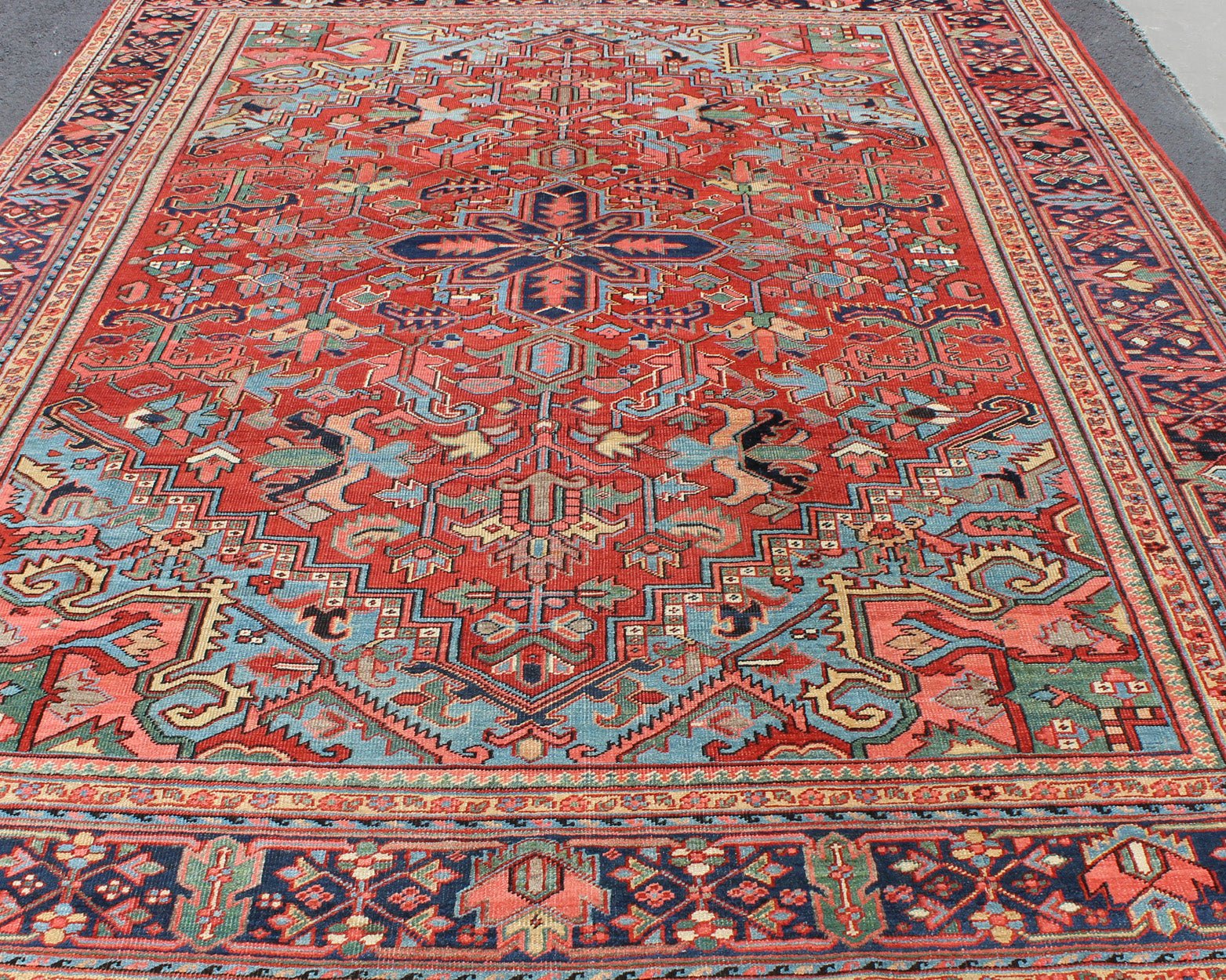 Antique Heriz - Serapi Rug with Small Central Medallion and Geometric Design Made in the early 20th Century in Iran, this charming antique Heriz features an open design and an array of cheerful colors. Surrounding its small central medallion, this... - Keivan Woven ArtsC - 0105 - 1726Rug
