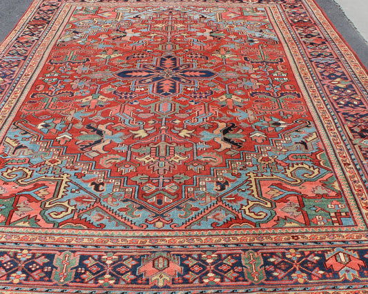 Antique Heriz - Serapi Rug with Small Central Medallion and Geometric Design Made in the early 20th Century in Iran, this charming antique Heriz features an open design and an array of cheerful colors. Surrounding its small central medallion, this... - Keivan Woven ArtsC - 0105 - 1726Rug