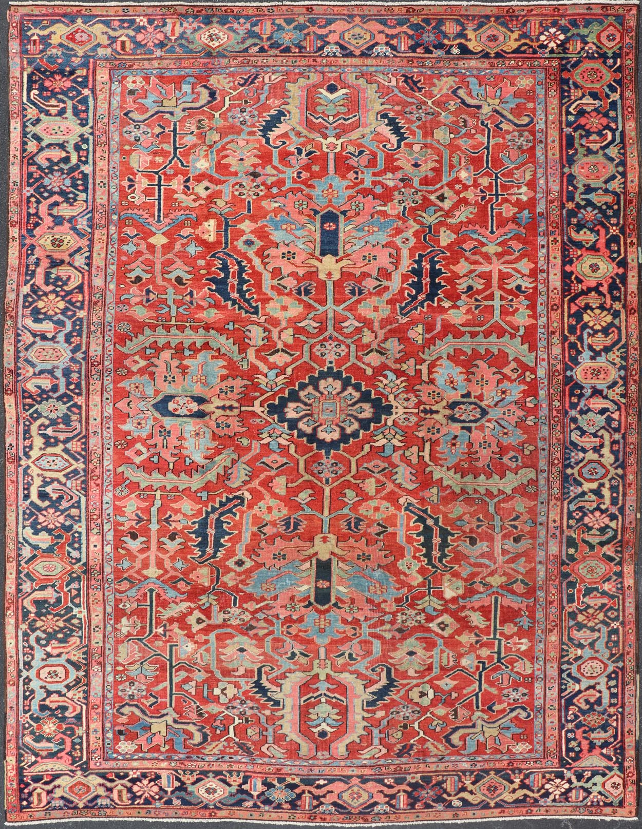 Antique Persian All Over Large Serapi Rug With Rust Red Background and Blue Border and large scale geometric Flowers. Keivan Woven Arts / Rug / C - 0301, country of origin / type: Iran /Serapi, circa 1900. Measures: 10' x 13'10. This Anti... - Keivan Woven ArtsC - 0301 - 451Rug