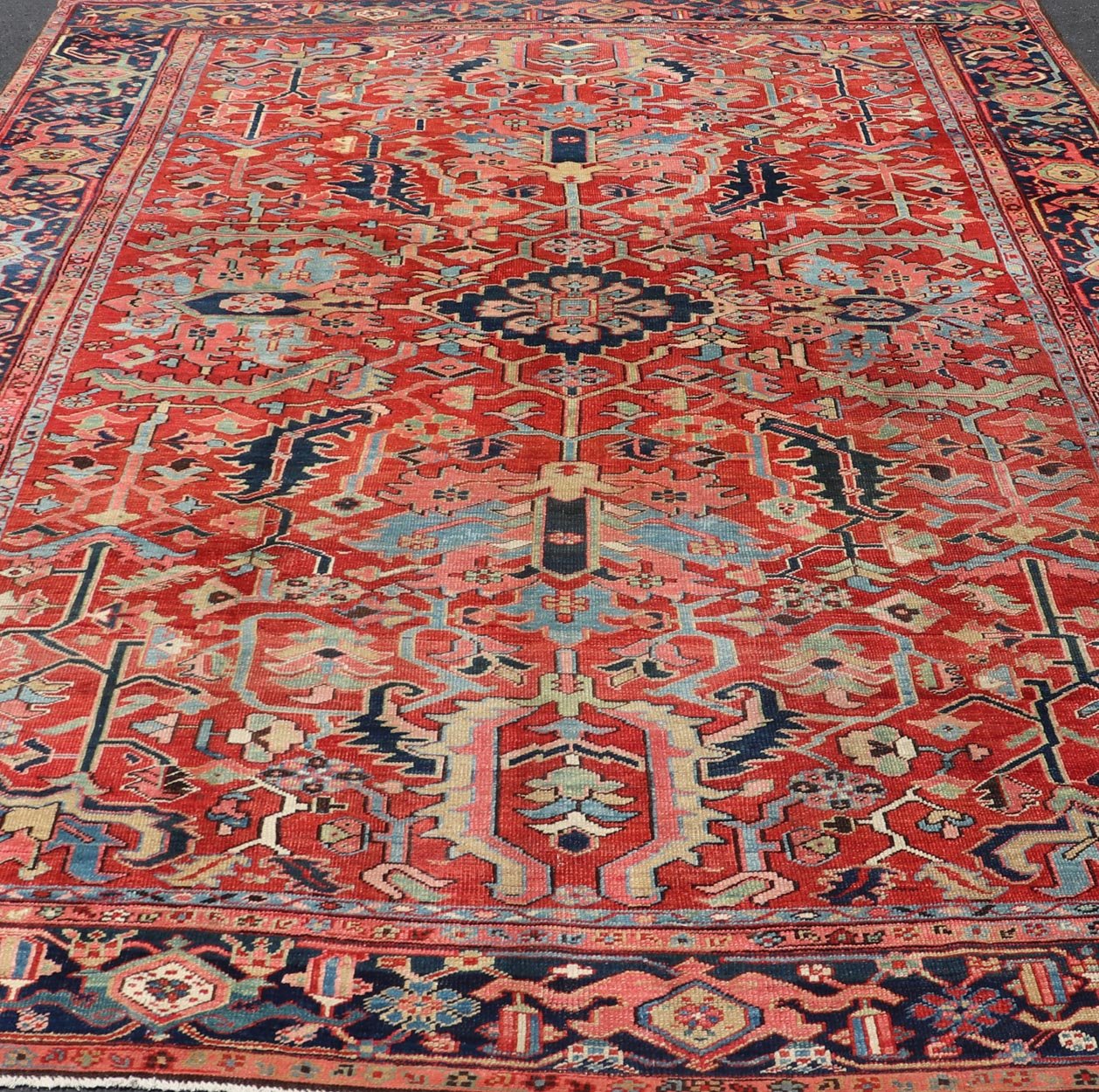 Antique Persian All Over Large Serapi Rug With Rust Red Background and Blue Border and large scale geometric Flowers. Keivan Woven Arts / Rug / C - 0301, country of origin / type: Iran /Serapi, circa 1900. Measures: 10' x 13'10. This Anti... - Keivan Woven ArtsC - 0301 - 451Rug