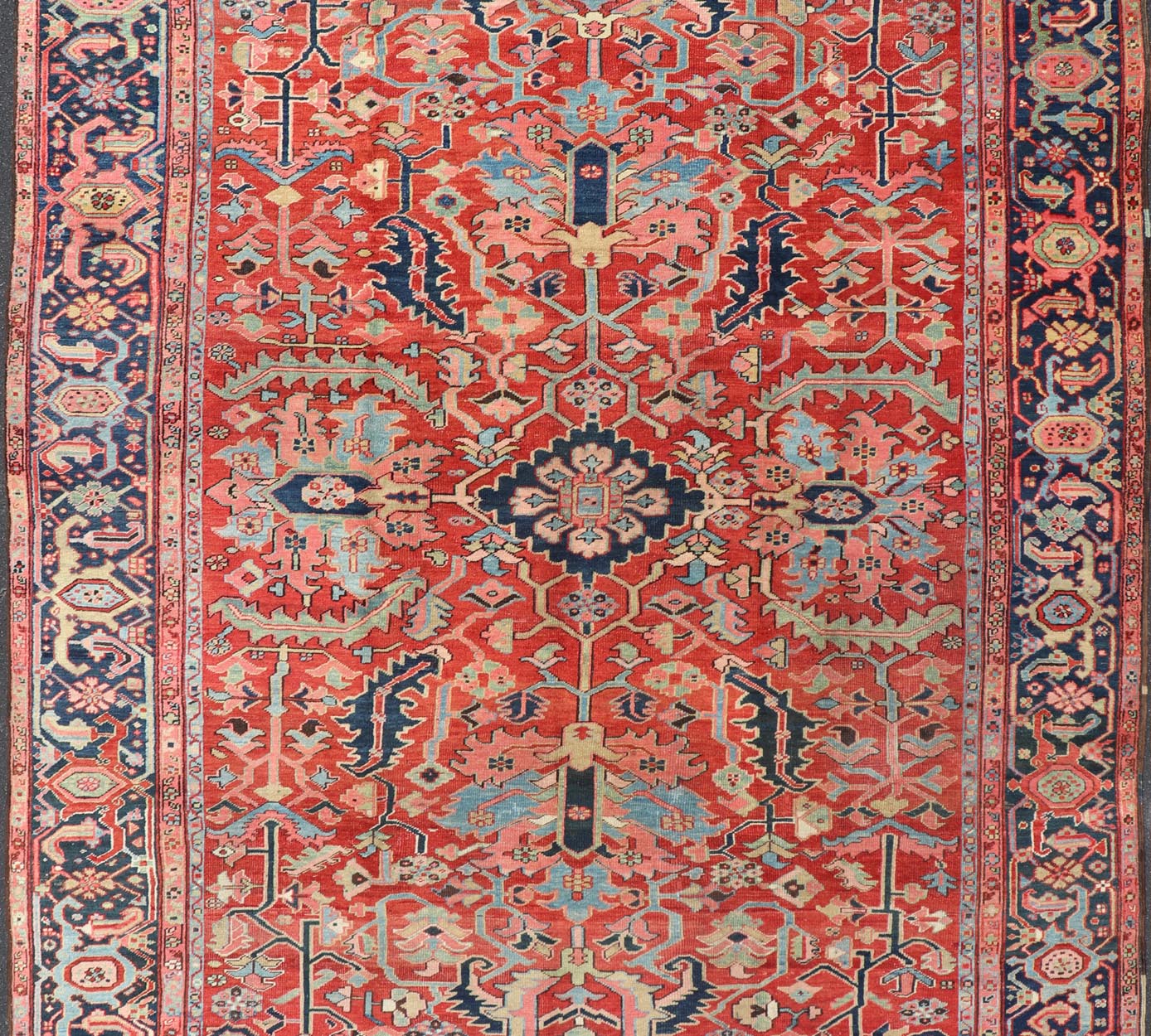 Antique Persian All Over Large Serapi Rug With Rust Red Background and Blue Border and large scale geometric Flowers. Keivan Woven Arts / Rug / C - 0301, country of origin / type: Iran /Serapi, circa 1900. Measures: 10' x 13'10. This Anti... - Keivan Woven ArtsC - 0301 - 451Rug