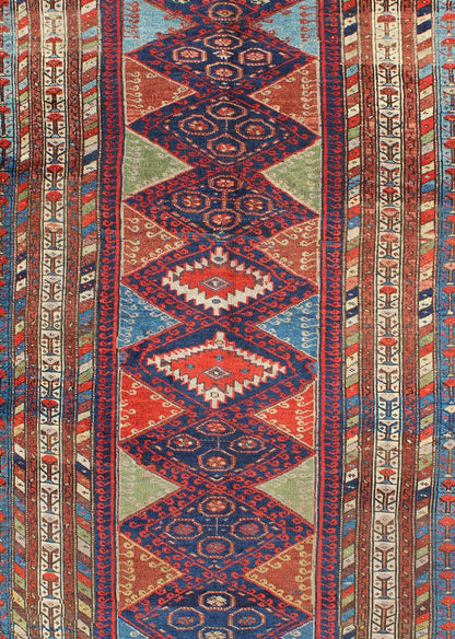 Antique Kurdish Kazak with Tribal and Geometric Motifs KWARUG C - 0525 Regardless of where you place this remarkable carpet, its stunning array of colors and exquisite geometric design will transport you to a place of rare, exotic beauty. Fashione... - Keivan Woven ArtsC - 0525 - 223