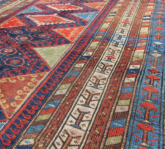 Antique Kurdish Kazak with Tribal and Geometric Motifs KWARUG C - 0525 Regardless of where you place this remarkable carpet, its stunning array of colors and exquisite geometric design will transport you to a place of rare, exotic beauty. Fashione... - Keivan Woven ArtsC - 0525 - 223