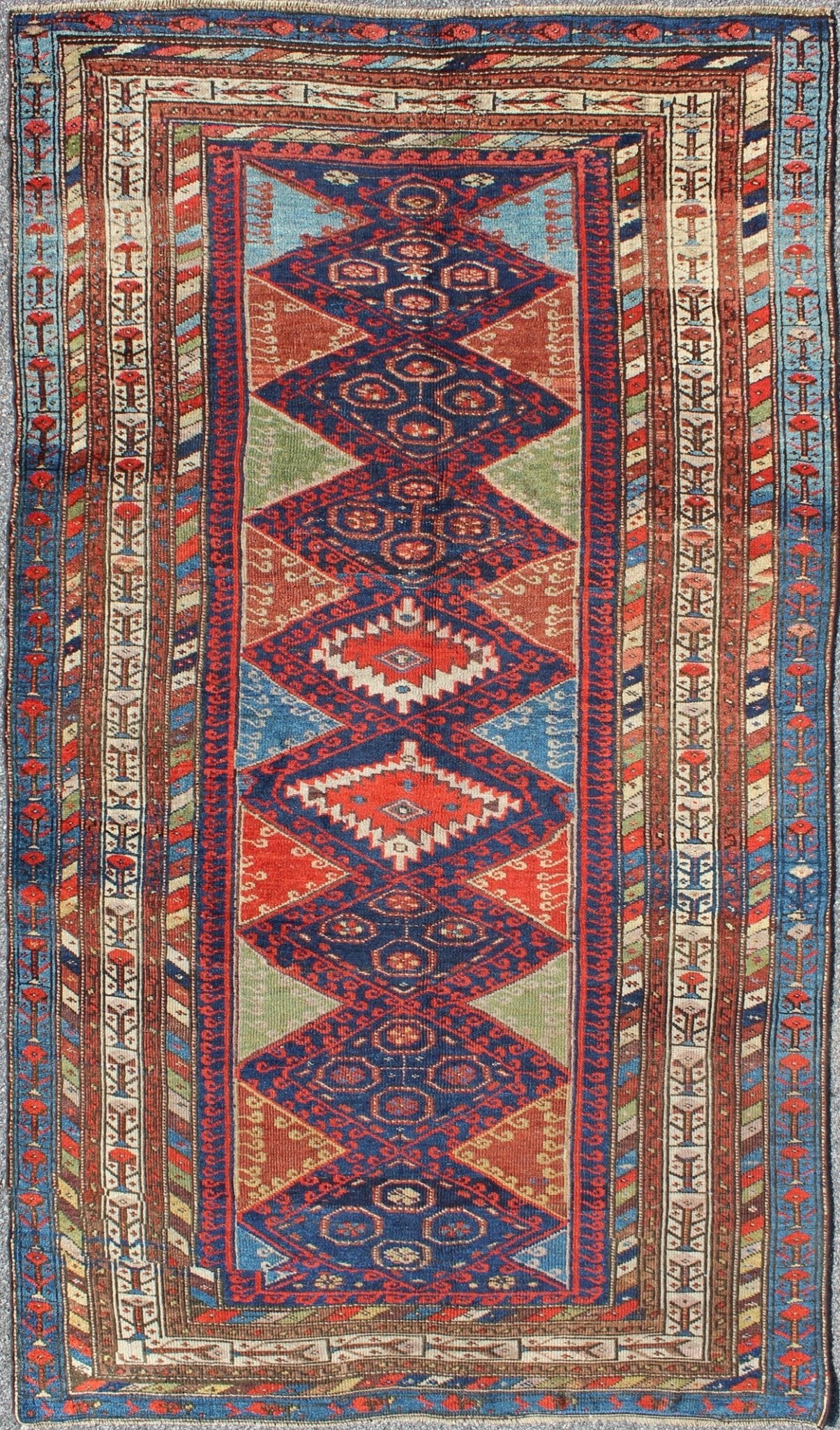 Antique Kurdish Kazak with Tribal and Geometric Motifs KWARUG C - 0525 Regardless of where you place this remarkable carpet, its stunning array of colors and exquisite geometric design will transport you to a place of rare, exotic beauty. Fashione... - Keivan Woven ArtsC - 0525 - 223