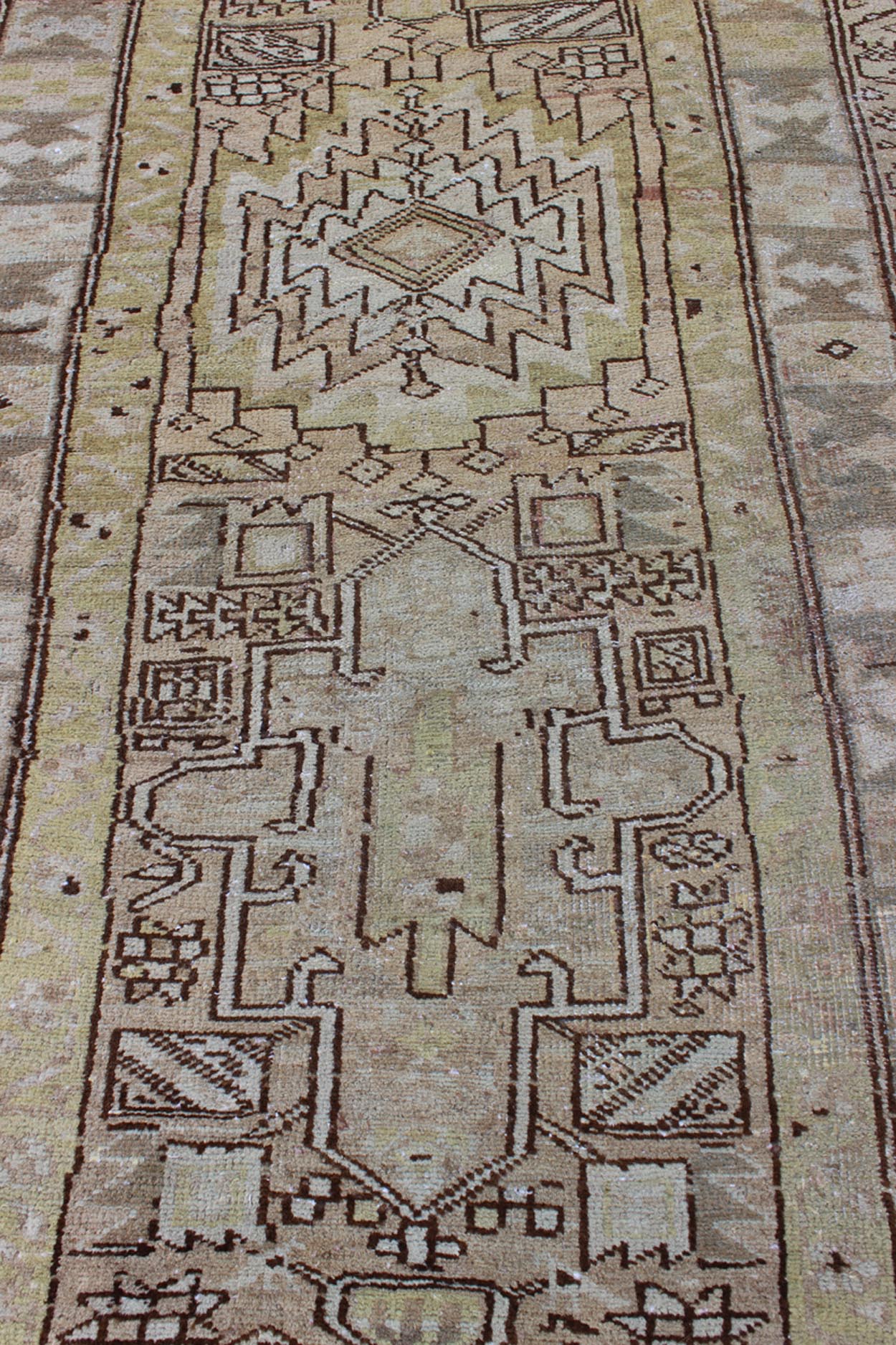 Antique Heriz Runner With Geometric Design in Taupe, Yellow Green, Olive & Brown. Long Antique Heriz Runner, rug /CA - 2440, country of origin / type: Persia / Heriz, circa 1930. This magnificent antique long Heriz runner from the early 20th Centur... - Keivan Woven ArtsCA - 2440 - 277