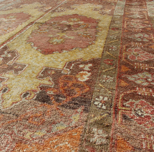 Oushak Rug with Two Medallion Panels in Yellow, Brown, Orange and Soft Red Unique midcentury Turkish Oushak rug with two medallion panels in yellow, brown, orange and soft red, Keivan Woven Arts / rug CA - 92941, country of origin / type: Turkey /... - Keivan Woven ArtsCA - 92941 - A - 996
