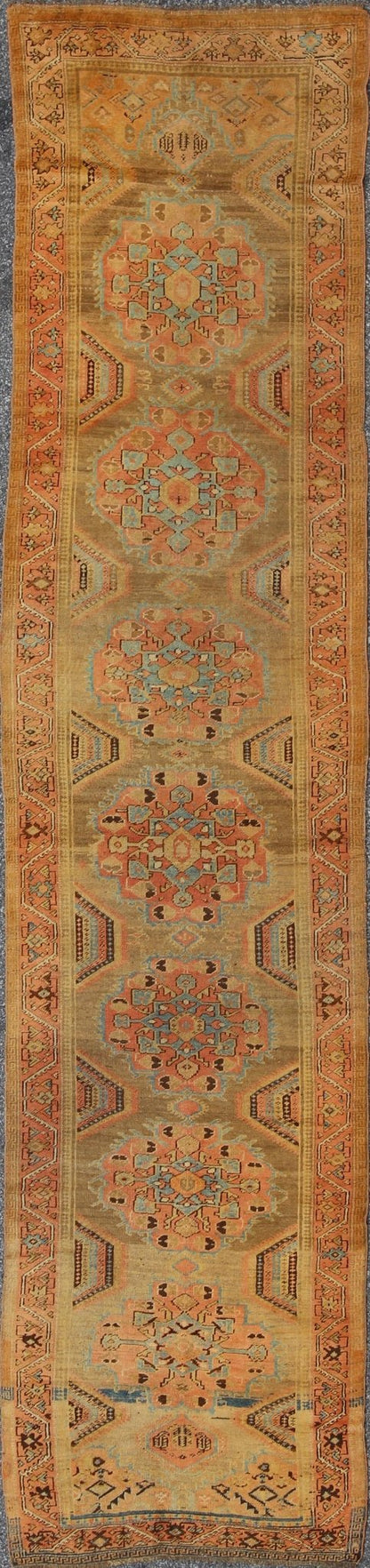 Early 20th Century Antique Oushak Runner with Medallions in Sand, Pink and Blue, rug chm - 2306, country of origin / type: Turkey / Oushak, circa 1920 This compelling and unique Oushak runner was made in the early 20th century, circa 1920, in Turk... - Keivan Woven ArtsCHM - 2306 - 1442Rug
