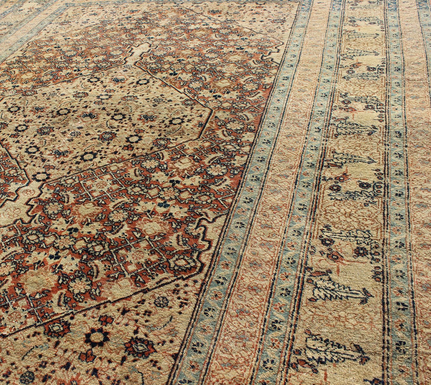 Antique Persian Tabriz Haj Jalili Rug This antique Persian Tabriz Haj Jalili rug features a sophisticated design and an unusual and unique color combination. Light gold and Persian blue stitching create a truly remarkable design in the center of... - Keivan Woven ArtsCN - 90801 - 1424Rug