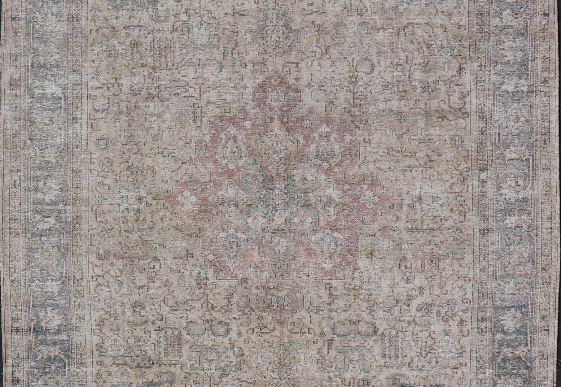 Vintage Distressed Persian Tabriz Rug in Light Blue and Earth Tones by Keivan Woven Arts Vintage Muted Persian Tabriz Rug With Large Tribal Medallion in Earthy Tones. Vintage Distressed Persian Rug. Vintage Muted Persian Tabriz Rug With Large Tr... - Keivan Woven ArtsCRV - 10056227 - 21511Rug