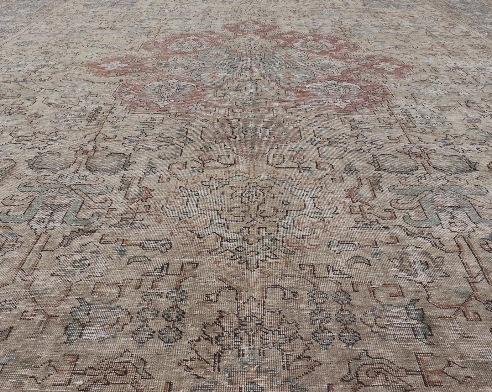Vintage Distressed Persian Tabriz Rug in Light Blue and Earth Tones by Keivan Woven Arts Vintage Muted Persian Tabriz Rug With Large Tribal Medallion in Earthy Tones. Vintage Distressed Persian Rug. Vintage Muted Persian Tabriz Rug With Large Tr... - Keivan Woven ArtsCRV - 10056227 - 21511