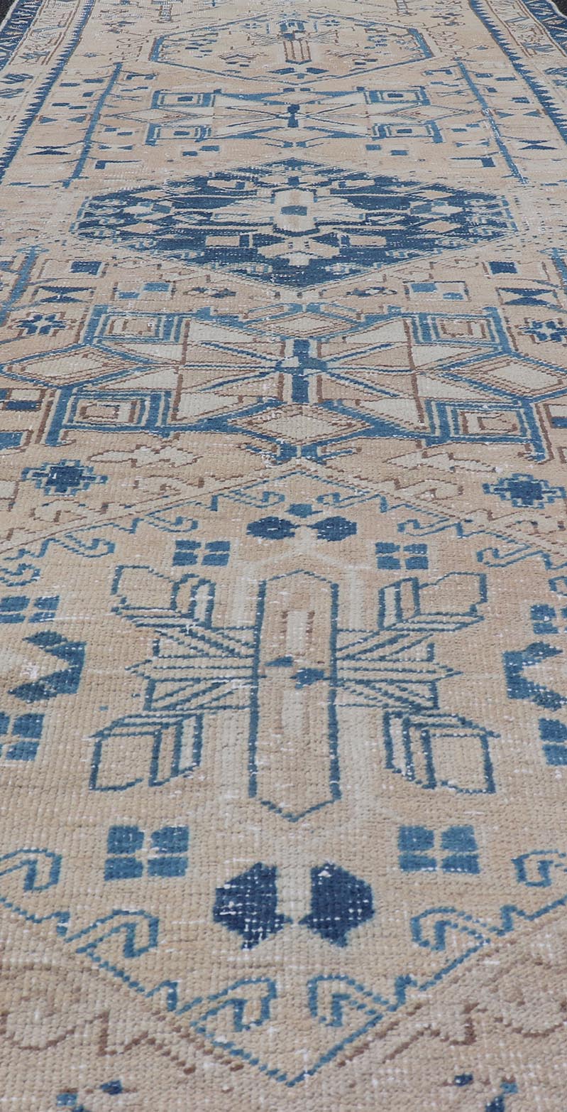 Vintage Persian Heriz Runner with Medallions in Light brown, Tan and Various Blue. Keivan Woven Arts rug CRV - 10056887, country of origin / type: Iran / Heriz, circa mid - 20th century Measures: 3'4 x 9'7 This magnificent Persian rug from the m... - Keivan Woven ArtsCRV - 10056887 - 21409Rug