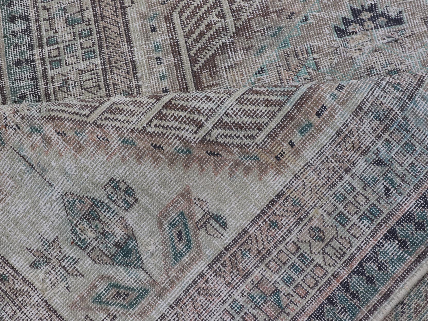 Vintage Persian Heriz Distressed Rug with Muted Colors and Medallion Design. Keivan Woven Arts / rug CRV - 10056889, country of origin / type: Iran / Tabriz, circa 1950 Measures: 3'4 x 10'4 This vintage Persian Tabriz carpet features a ref... - Keivan Woven ArtsCRV - 10056889 - 21415Rug