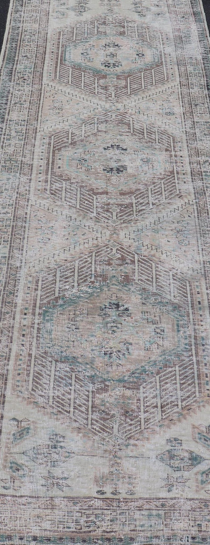 Vintage Persian Heriz Distressed Rug with Muted Colors and Medallion Design. Keivan Woven Arts / rug CRV - 10056889, country of origin / type: Iran / Tabriz, circa 1950 Measures: 3'4 x 10'4 This vintage Persian Tabriz carpet features a ref... - Keivan Woven ArtsCRV - 10056889 - 21415Rug