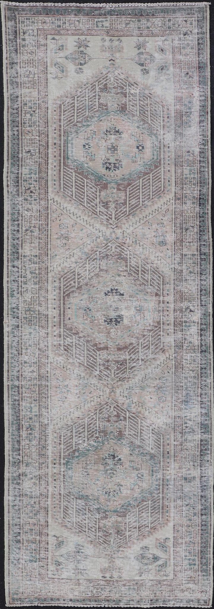 Vintage Persian Heriz Distressed Rug with Muted Colors and Medallion Design. Keivan Woven Arts / rug CRV - 10056889, country of origin / type: Iran / Tabriz, circa 1950 Measures: 3'4 x 10'4 This vintage Persian Tabriz carpet features a ref... - Keivan Woven ArtsCRV - 10056889 - 21415Rug