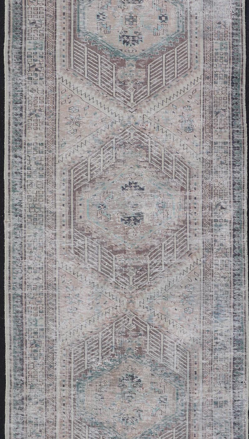 Vintage Persian Heriz Distressed Rug with Muted Colors and Medallion Design. Keivan Woven Arts / rug CRV - 10056889, country of origin / type: Iran / Tabriz, circa 1950 Measures: 3'4 x 10'4 This vintage Persian Tabriz carpet features a ref... - Keivan Woven ArtsCRV - 10056889 - 21415Rug