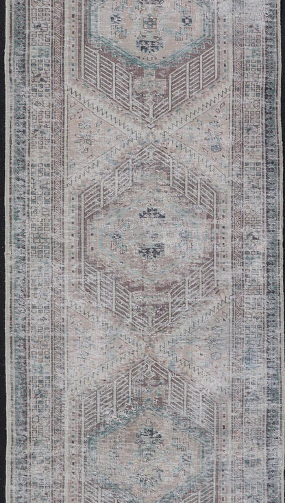Vintage Persian Heriz Distressed Rug with Muted Colors and Medallion Design. Keivan Woven Arts / rug CRV - 10056889, country of origin / type: Iran / Tabriz, circa 1950 Measures: 3'4 x 10'4 This vintage Persian Tabriz carpet features a ref... - Keivan Woven ArtsCRV - 10056889 - 21415Rug