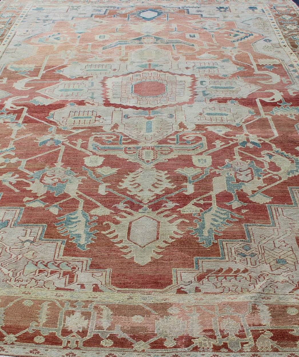 Antique Persian Serapi Rug This late 19th Century Serapi carpet displays an unusually light color palette and geometric design. A large multifaceted medallion of muted grays, taupes, blues and ivory rests upon a field in various shades of soft r... - Keivan Woven ArtsD - 0402 - 463Rug