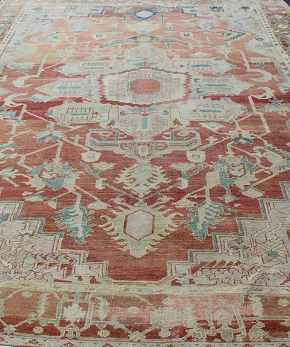 Antique Persian Serapi Rug This late 19th Century Serapi carpet displays an unusually light color palette and geometric design. A large multifaceted medallion of muted grays, taupes, blues and ivory rests upon a field in various shades of soft r... - Keivan Woven ArtsD - 0402 - 463Rug