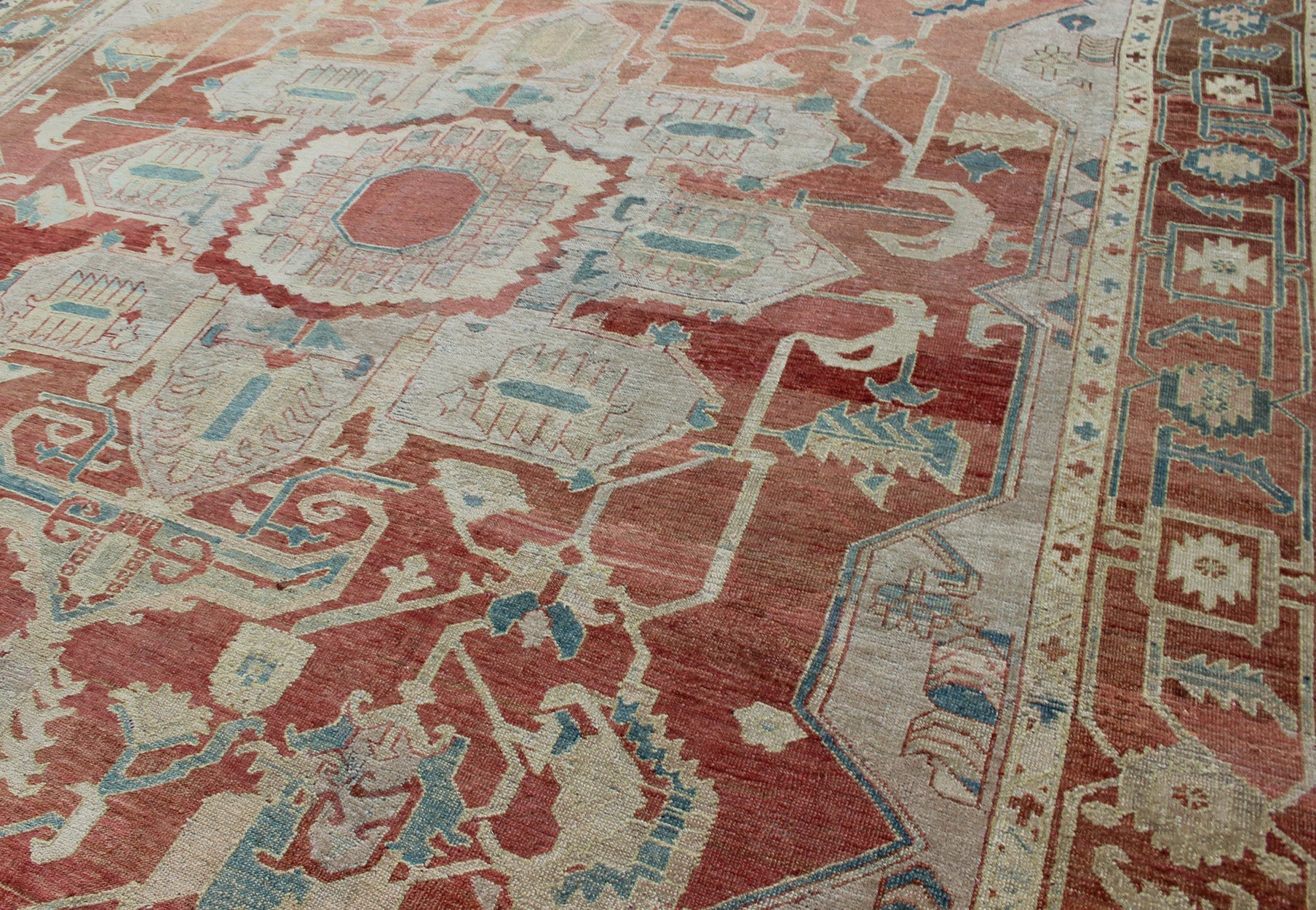 Antique Persian Serapi Rug This late 19th Century Serapi carpet displays an unusually light color palette and geometric design. A large multifaceted medallion of muted grays, taupes, blues and ivory rests upon a field in various shades of soft r... - Keivan Woven ArtsD - 0402 - 463Rug