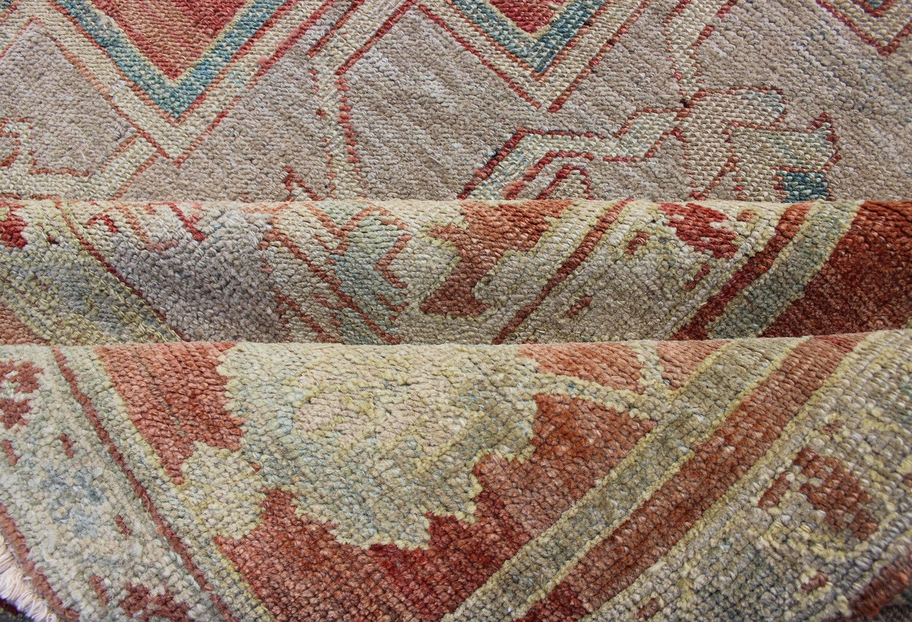 Antique Persian Serapi Rug This late 19th Century Serapi carpet displays an unusually light color palette and geometric design. A large multifaceted medallion of muted grays, taupes, blues and ivory rests upon a field in various shades of soft r... - Keivan Woven ArtsD - 0402 - 463Rug