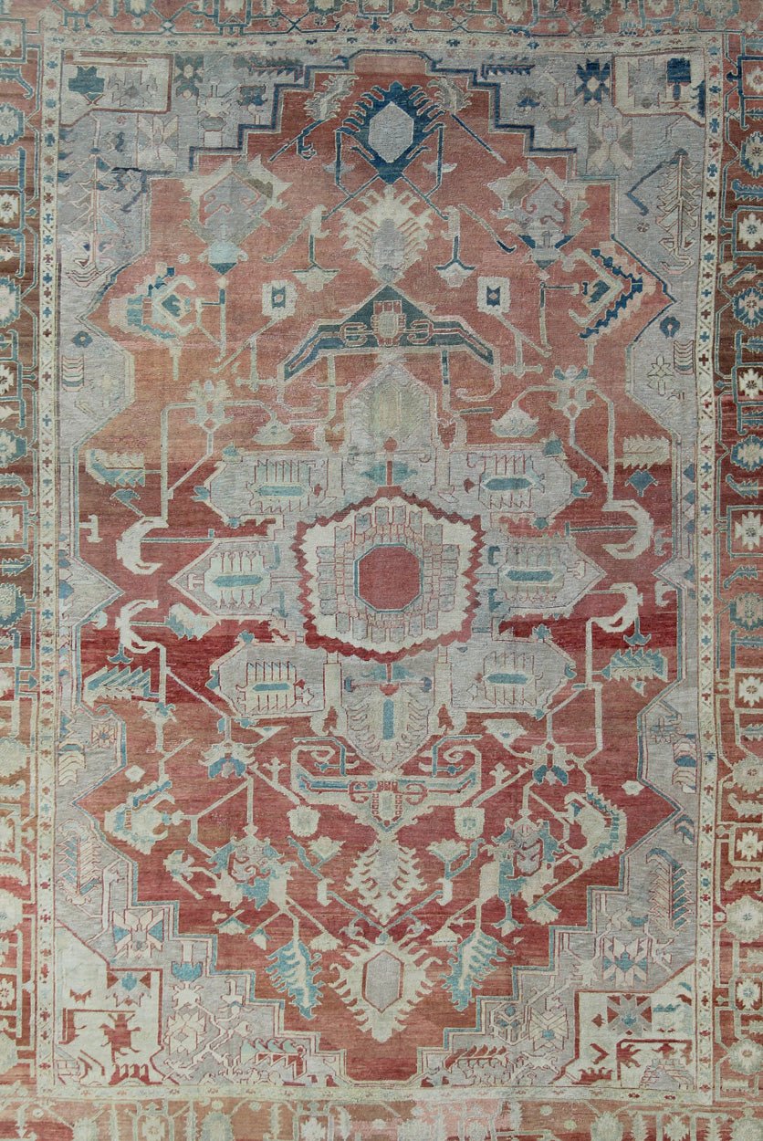 Antique Persian Serapi Rug This late 19th Century Serapi carpet displays an unusually light color palette and geometric design. A large multifaceted medallion of muted grays, taupes, blues and ivory rests upon a field in various shades of soft r... - Keivan Woven ArtsD - 0402 - 463Rug