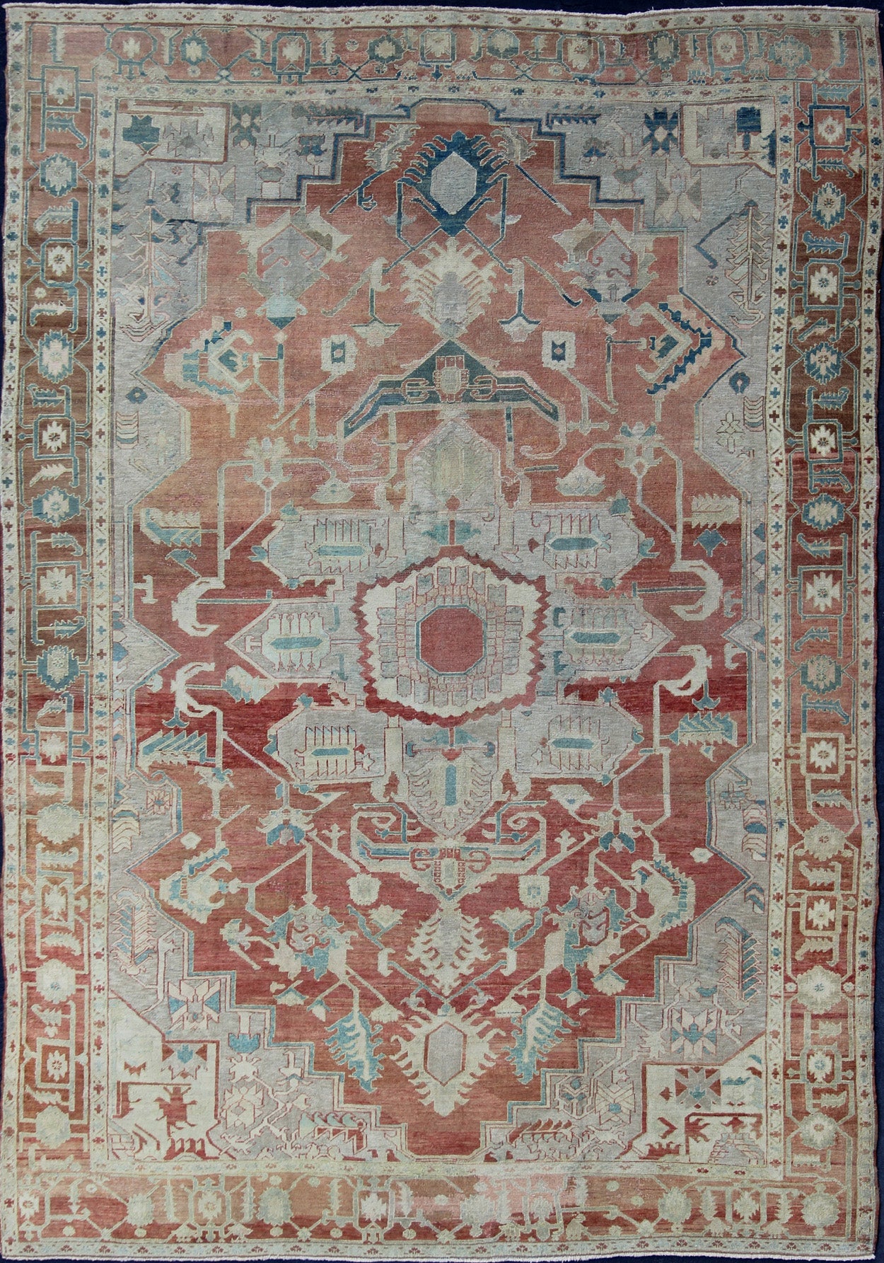Antique Persian Serapi Rug This late 19th Century Serapi carpet displays an unusually light color palette and geometric design. A large multifaceted medallion of muted grays, taupes, blues and ivory rests upon a field in various shades of soft r... - Keivan Woven ArtsD - 0402 - 463Rug