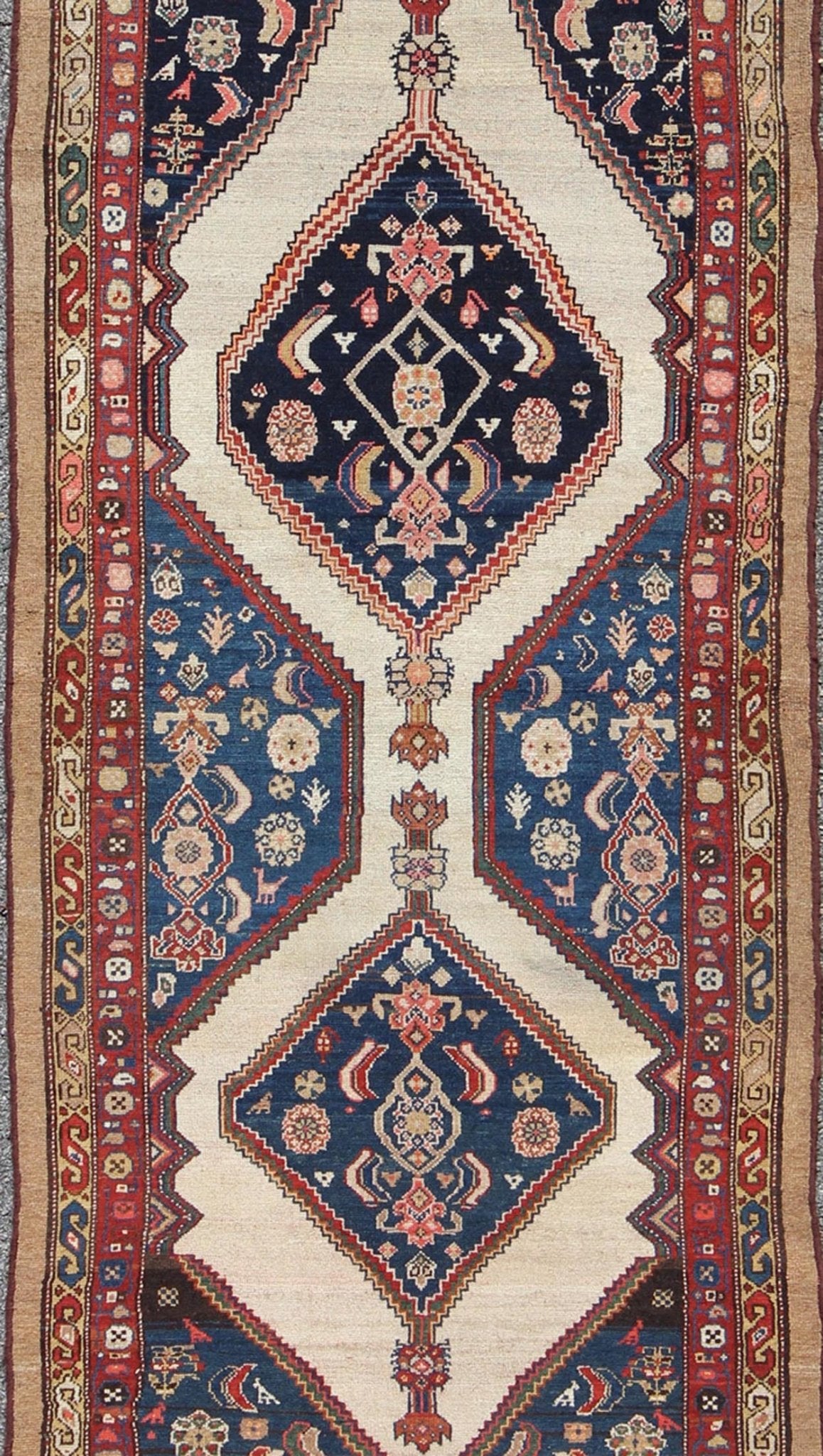 Antique Serab Runner This rare Antique Serab runner from the late 19th Century contains beautiful multi - colored dual medallions set within a contained border of cream. This is surrounded by a delightful field of blue, containing patterns of flow... - Keivan Woven ArtsD - 0529 - 1382Rug