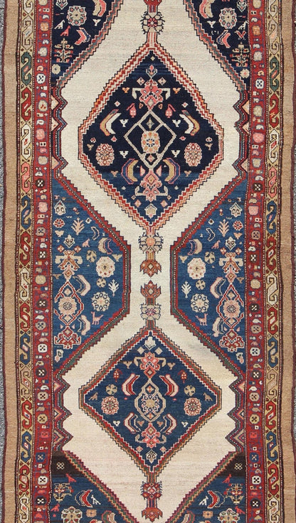 Antique Serab Runner This rare Antique Serab runner from the late 19th Century contains beautiful multi - colored dual medallions set within a contained border of cream. This is surrounded by a delightful field of blue, containing patterns of flow... - Keivan Woven ArtsD - 0529 - 1382Rug