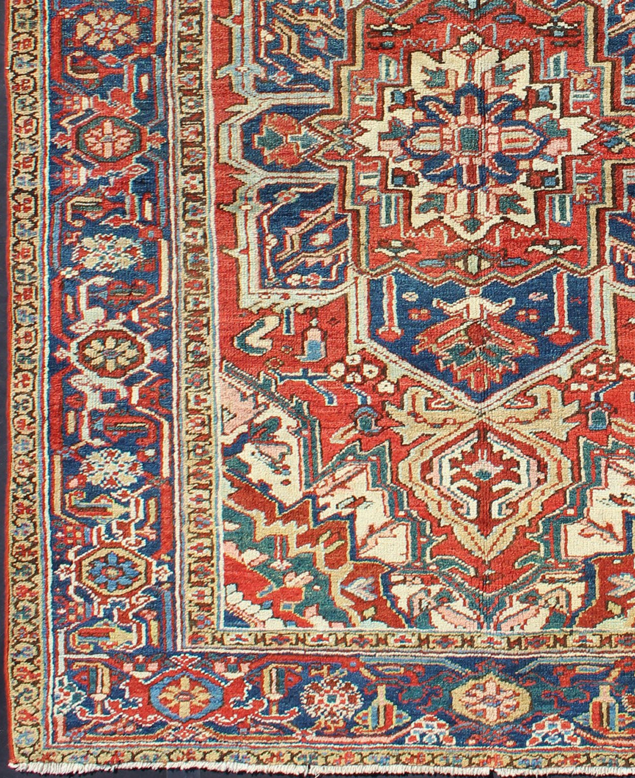 Antique Heriz - Serapi Rug This antique Persian Heriz - Serapi from the early 20th century bears an exquisite design rendered in gorgeous, warm hues of red and denim blue. A highly stylized geometric center medallion anchors the piece and is surroun... - Keivan Woven ArtsD - 0908 - 2205Rug