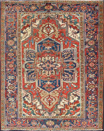 Antique Heriz - Serapi Rug This antique Persian Heriz - Serapi from the early 20th century bears an exquisite design rendered in gorgeous, warm hues of red and denim blue. A highly stylized geometric center medallion anchors the piece and is surroun... - Keivan Woven ArtsD - 0908 - 2205Rug