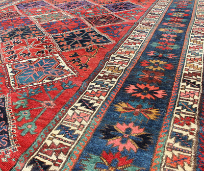 Antique Persian Qashqai Rug with Tulips, Diamond Patterns and Star Motifs This amazing antique Persian Qashqai rug originates from the tribes of southwestern Iran and features a wonderful geometric pattern and traditional color palette. The vari... - Keivan Woven ArtsD - 0909 - 862Rug