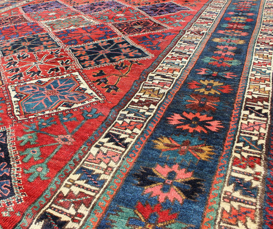 Antique Persian Qashqai Rug with Tulips, Diamond Patterns and Star Motifs This amazing antique Persian Qashqai rug originates from the tribes of southwestern Iran and features a wonderful geometric pattern and traditional color palette. The vari... - Keivan Woven ArtsD - 0909 - 862Rug