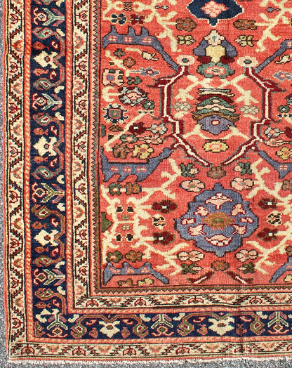 Antique Persian Sultanabad Rug A beautiful Sultanabad rug, this piece features a cinnamon - shaded field bearing an intricate floral motif of repeating red, light purple and pink flowers. A thin blue border displays straight rows of single blossom... - Keivan Woven ArtsD - 0924 - 1847Rug