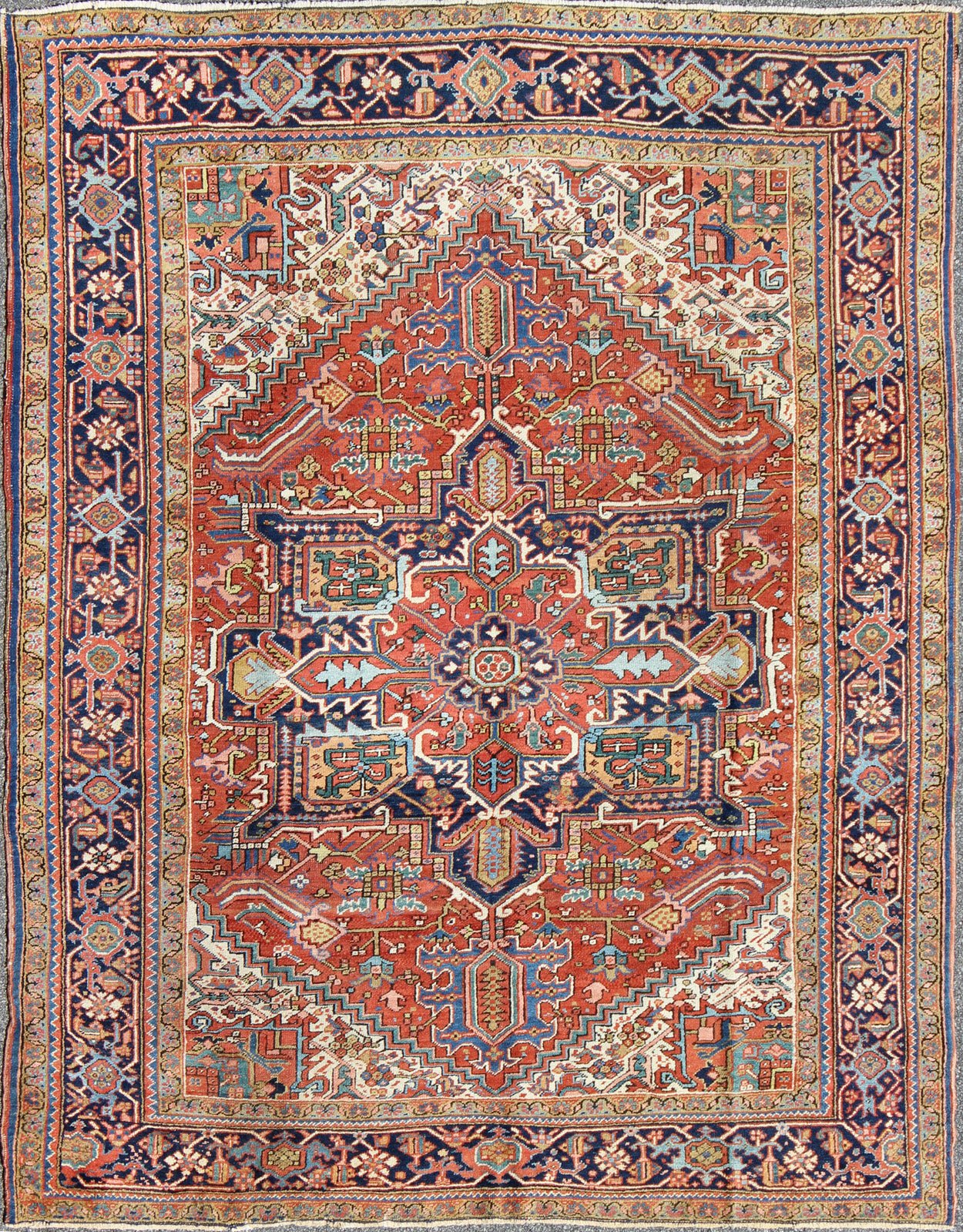 Antique Colorful Persian Heriz Rug with Geometric Patterns and Intricate Design. Keivan Woven Arts / rug D - 0927, country of origin / type: Iran / Heriz, Heriz - Serapi , circa 1920 Measures: 8'3 x 10'4 This magnificent antique Persian He... - Keivan Woven ArtsD - 0927 - 758Rug