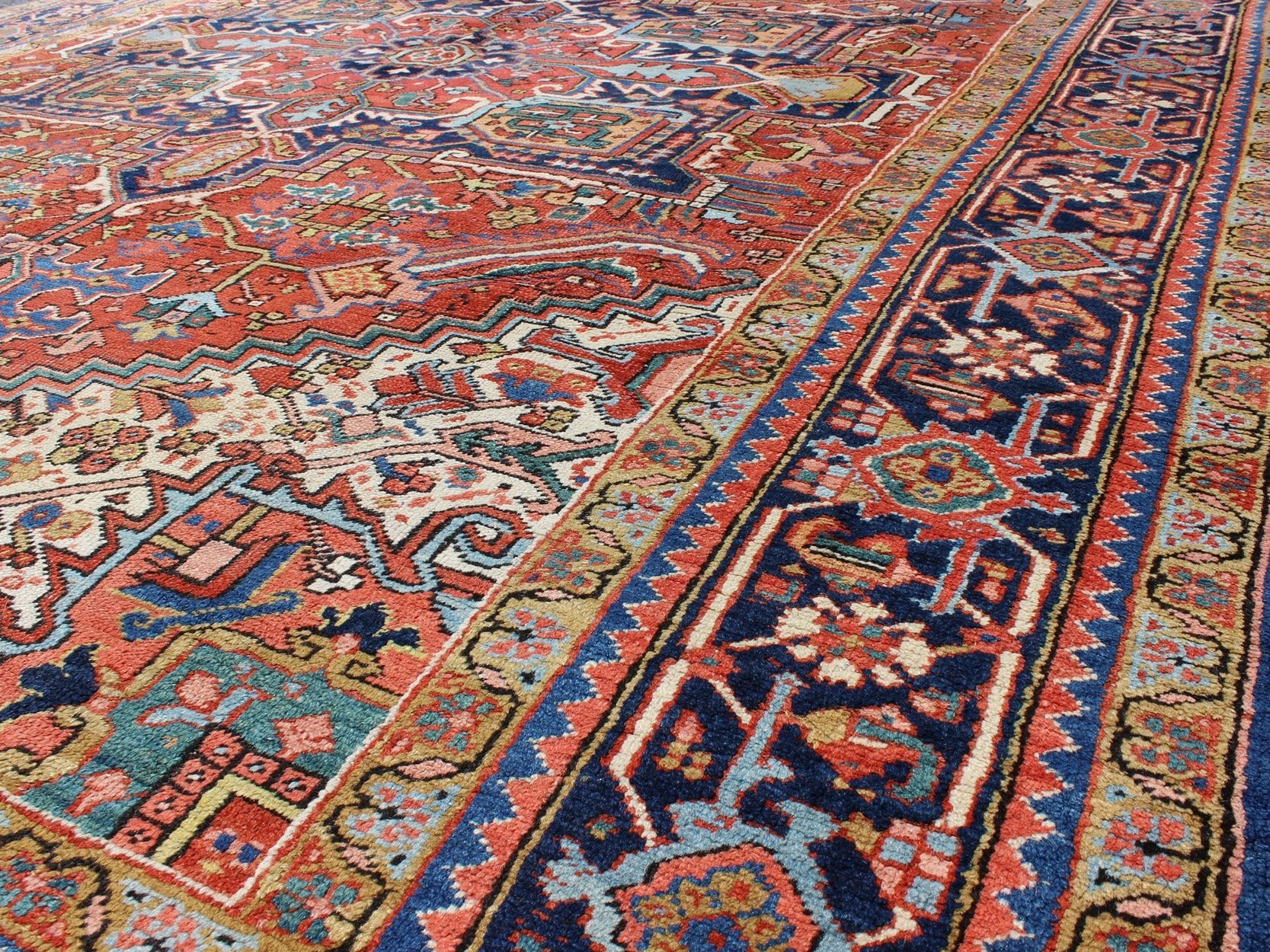 Antique Colorful Persian Heriz Rug with Geometric Patterns and Intricate Design. Keivan Woven Arts / rug D - 0927, country of origin / type: Iran / Heriz, Heriz - Serapi , circa 1920 Measures: 8'3 x 10'4 This magnificent antique Persian He... - Keivan Woven ArtsD - 0927 - 758Rug