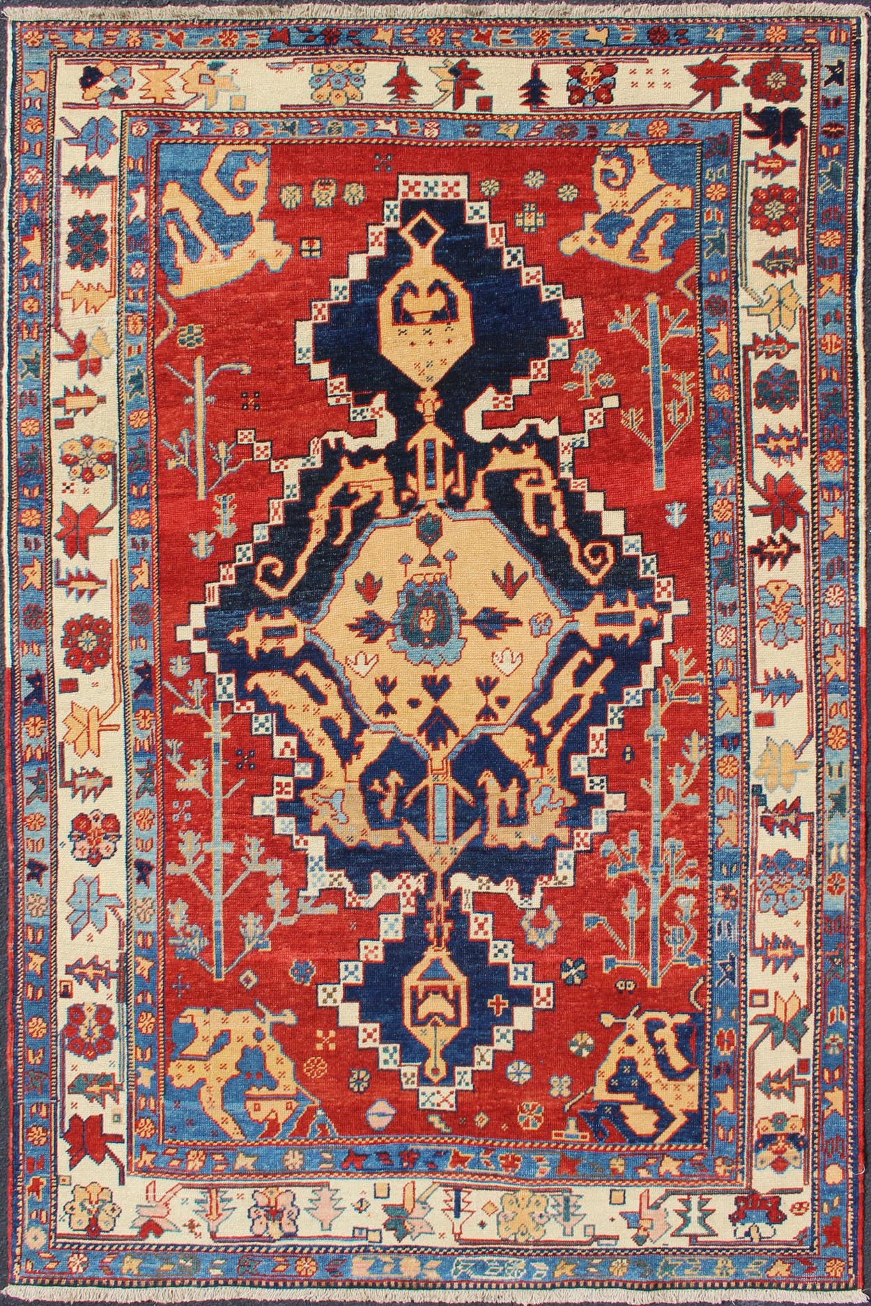 Vintage Turkish Tribal Rug with Jewel - Toned Central Medallion and Vivid Border This vintage Turkish Tribal rug features a large central medallion and a jewel - toned geometric design surrounded by a vivid blue and ivory border. Measures: 4'9 x ... - Keivan Woven ArtsDSP - WL30362 - 4134Rug