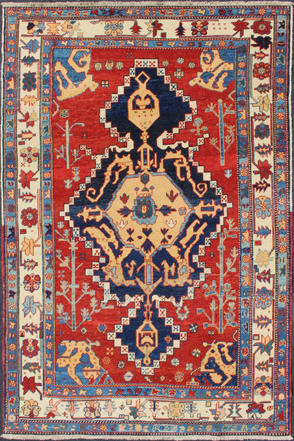 Vintage Turkish Tribal Rug with Jewel - Toned Central Medallion and Vivid Border This vintage Turkish Tribal rug features a large central medallion and a jewel - toned geometric design surrounded by a vivid blue and ivory border. Measures: 4'9 x ... - Keivan Woven ArtsDSP - WL30362 - 4134Rug