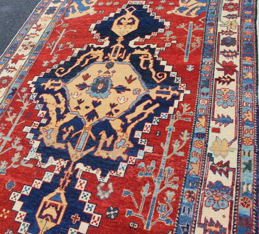 Vintage Turkish Tribal Rug with Jewel - Toned Central Medallion and Vivid Border This vintage Turkish Tribal rug features a large central medallion and a jewel - toned geometric design surrounded by a vivid blue and ivory border. Measures: 4'9 x ... - Keivan Woven ArtsDSP - WL30362 - 4134Rug