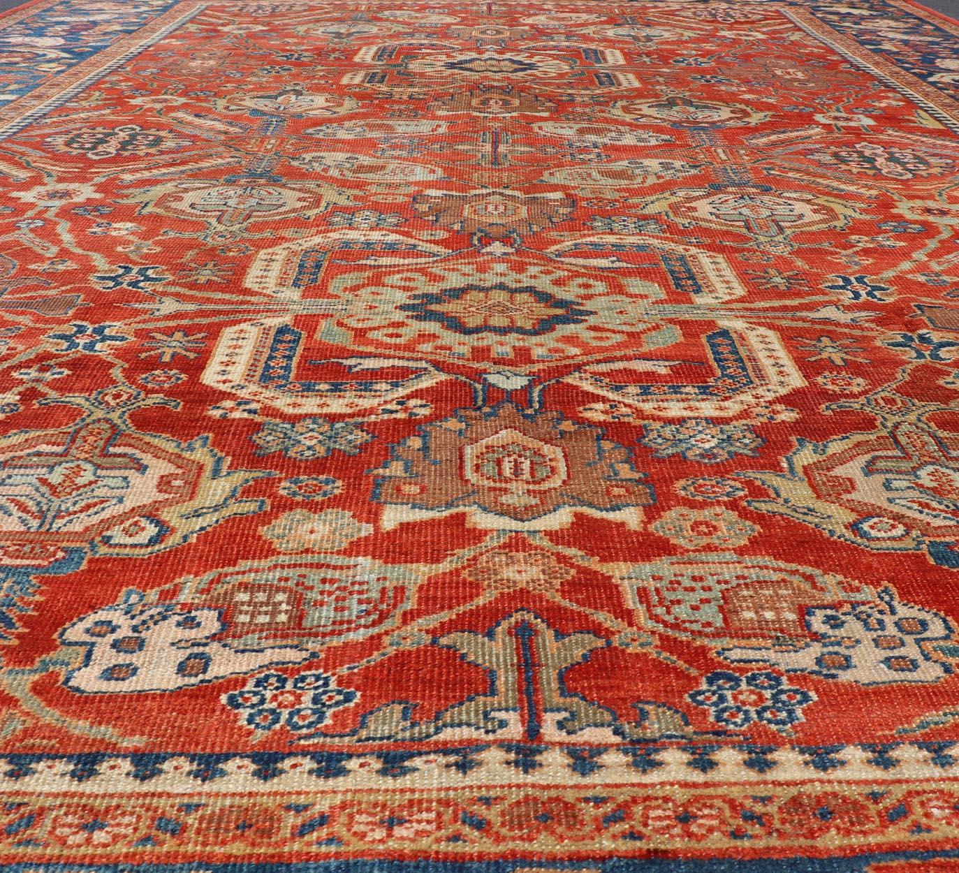 Antique Sultanabad Carpet This large and inspiring Sultanabad from the late 19 century is set apart from its peers due to its all over geometric design which floods the primary field. A luxurious base of soft tomato red contains a meticulous arr... - Keivan Woven ArtsE - 0101 - 475Rug