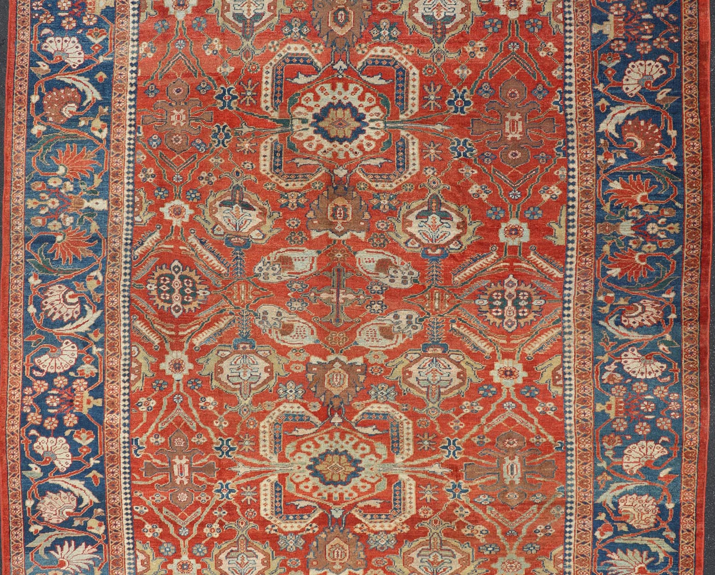 Antique Sultanabad Carpet This large and inspiring Sultanabad from the late 19 century is set apart from its peers due to its all over geometric design which floods the primary field. A luxurious base of soft tomato red contains a meticulous arr... - Keivan Woven ArtsE - 0101 - 475Rug