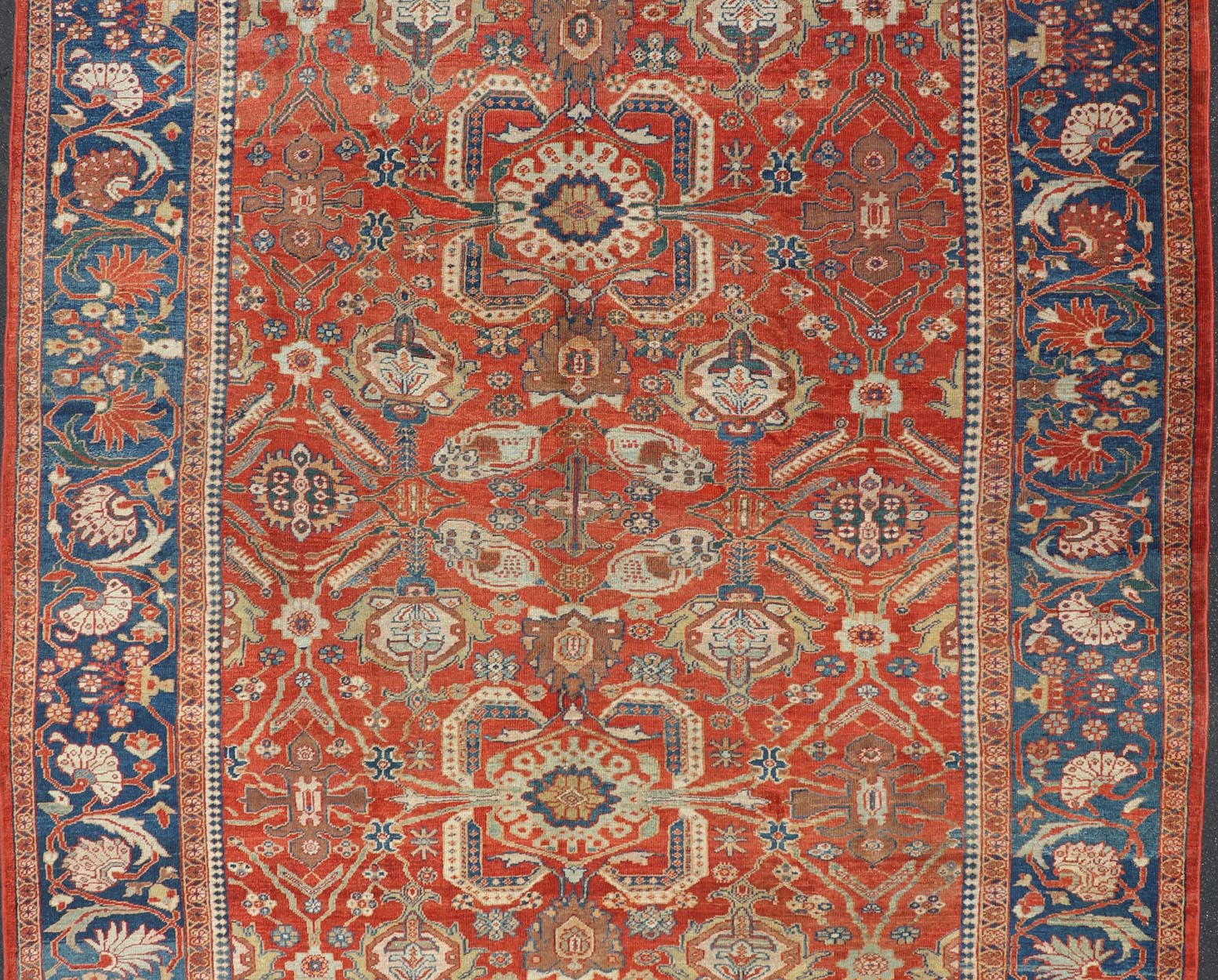 Antique Sultanabad Carpet This large and inspiring Sultanabad from the late 19 century is set apart from its peers due to its all over geometric design which floods the primary field. A luxurious base of soft tomato red contains a meticulous arr... - Keivan Woven ArtsE - 0101 - 475Rug