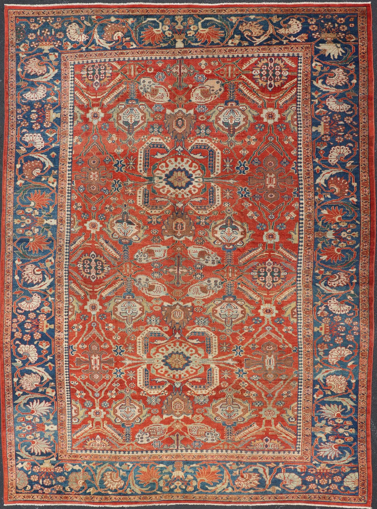 Antique Sultanabad Carpet This large and inspiring Sultanabad from the late 19 century is set apart from its peers due to its all over geometric design which floods the primary field. A luxurious base of soft tomato red contains a meticulous arr... - Keivan Woven ArtsE - 0101 - 475Rug