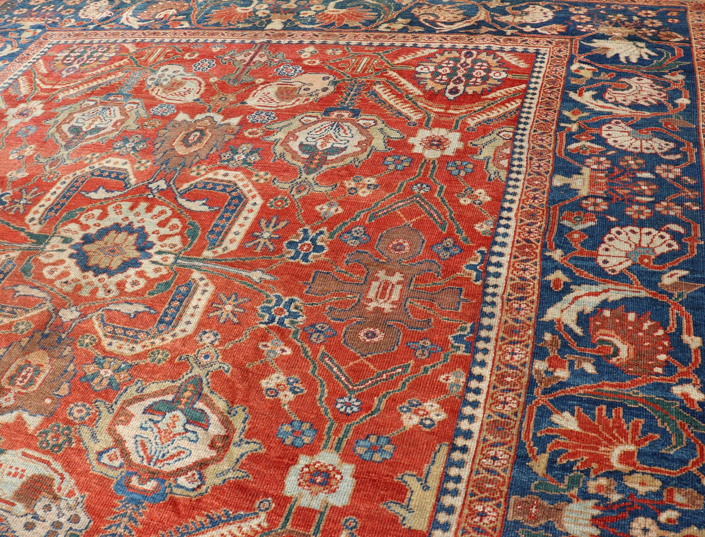 Antique Sultanabad Carpet This large and inspiring Sultanabad from the late 19 century is set apart from its peers due to its all over geometric design which floods the primary field. A luxurious base of soft tomato red contains a meticulous arr... - Keivan Woven ArtsE - 0101 - 475Rug