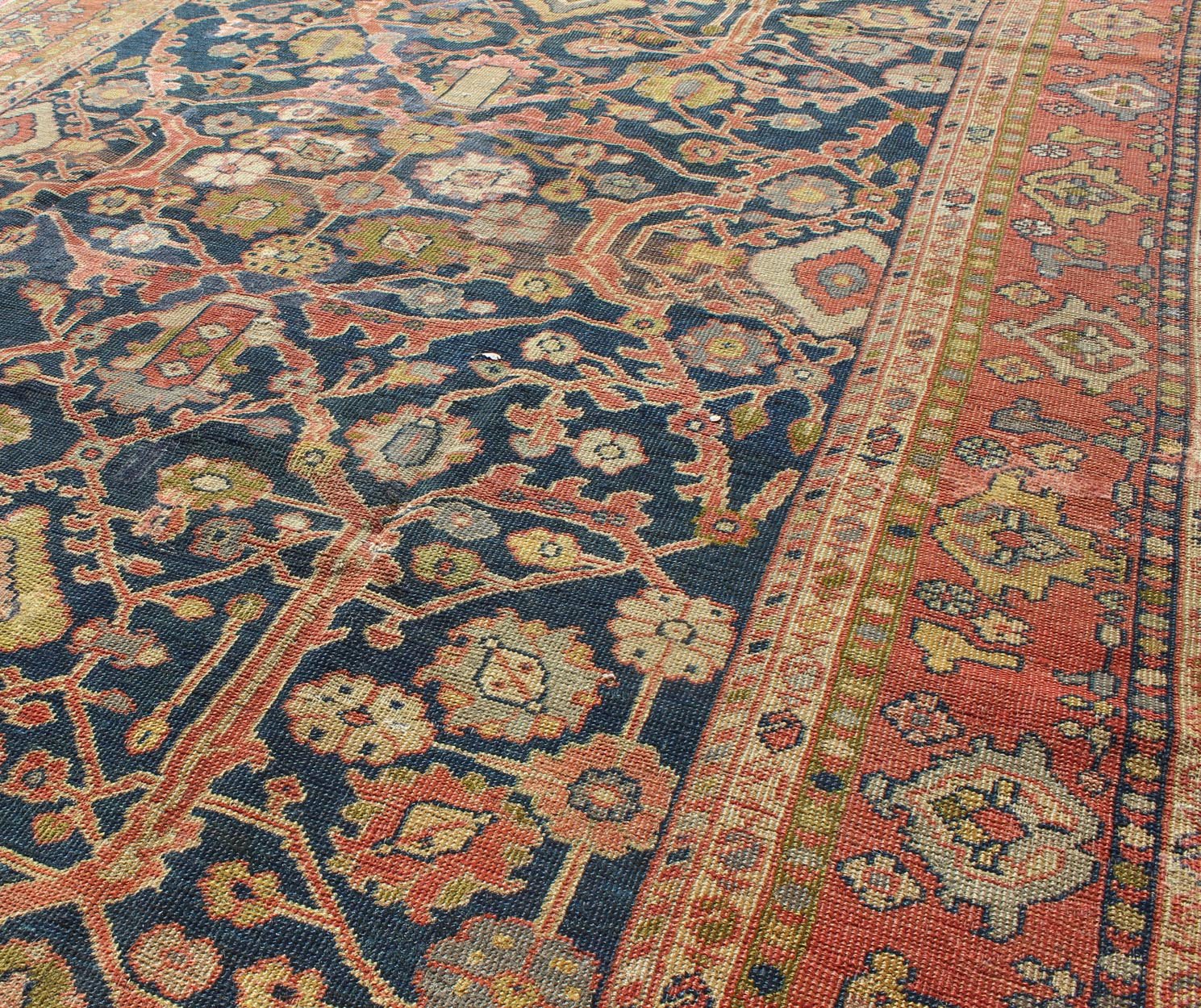 Antique Sultanabad This Antique Sultanabad displays a glorious all - over design imbued with a rich palette of colors. Breathtaking flowers of various colors interweave throughout the main field and are surrounded by a warm - toned border. - Keivan Woven ArtsE - 0512 - 52Rug