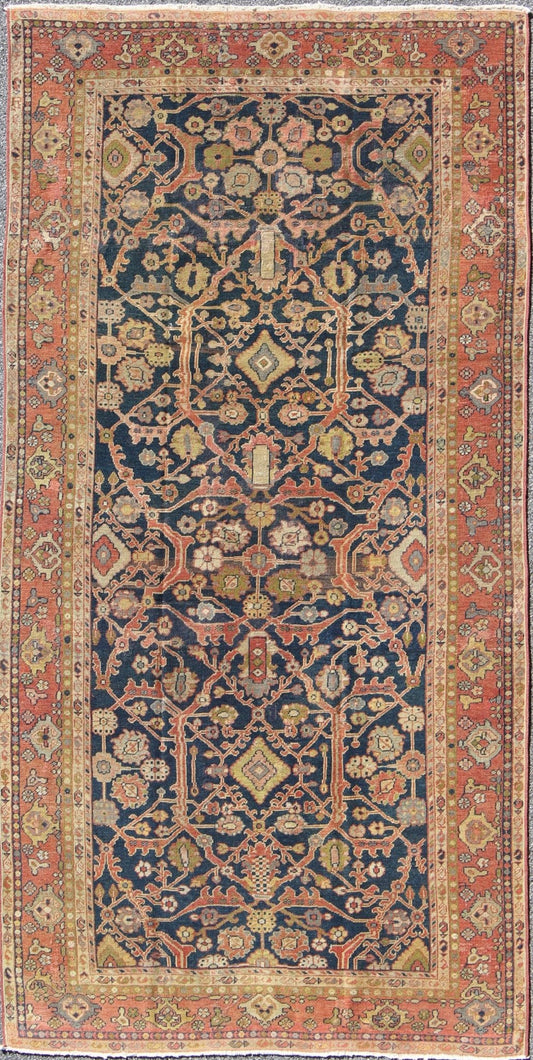 This Antique Sultanabad displays a glorious all over design imbued with a rich palate of colors. Breathtaking flowers of various colors interweave throughout the main field and are surrounded by a warm toned border. - Keivan Woven ArtsE - 0512 - 964Rug