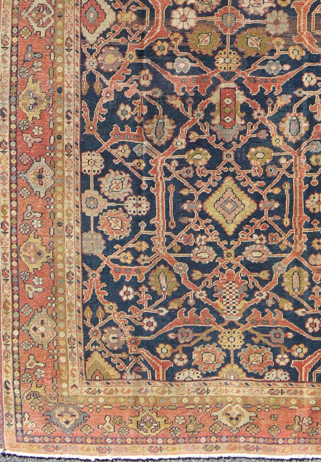 This Antique Sultanabad displays a glorious all over design imbued with a rich palate of colors. Breathtaking flowers of various colors interweave throughout the main field and are surrounded by a warm toned border. - Keivan Woven ArtsE - 0512 - 964Rug