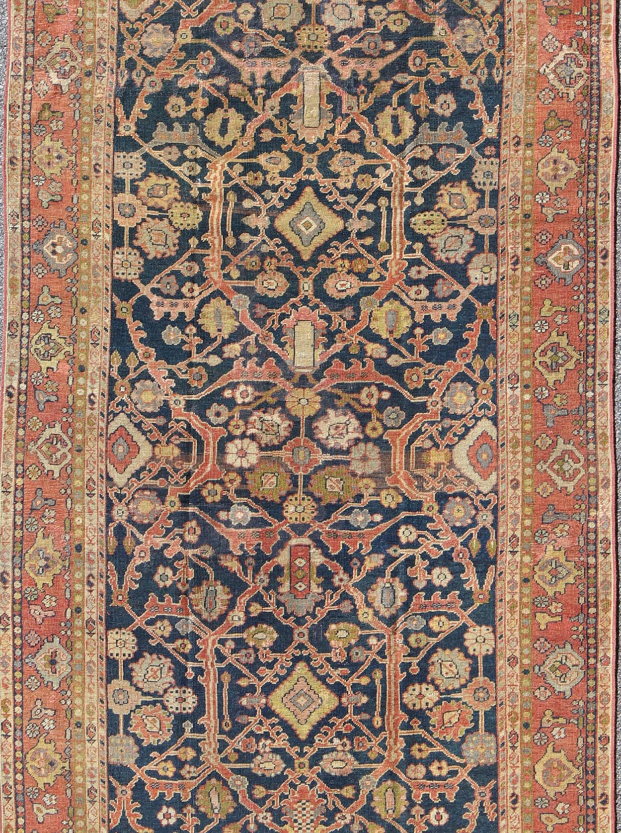 This Antique Sultanabad displays a glorious all over design imbued with a rich palate of colors. Breathtaking flowers of various colors interweave throughout the main field and are surrounded by a warm toned border. - Keivan Woven ArtsE - 0512 - 964Rug