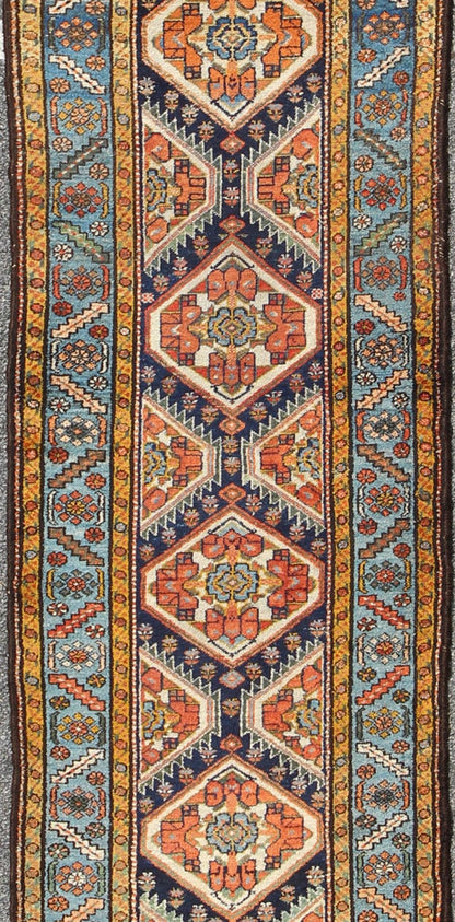 Colorful 1920s Antique N.W. Persian Runner with Sub - Geometric Medallions, rug e - 0603, country of origin / type: Iran / N.W. Persian, circa 1920 This Northwest Persian runner features a deep blue background flanked by multiple light blue and yell... - Keivan Woven ArtsE - 0603 - 1446Rug